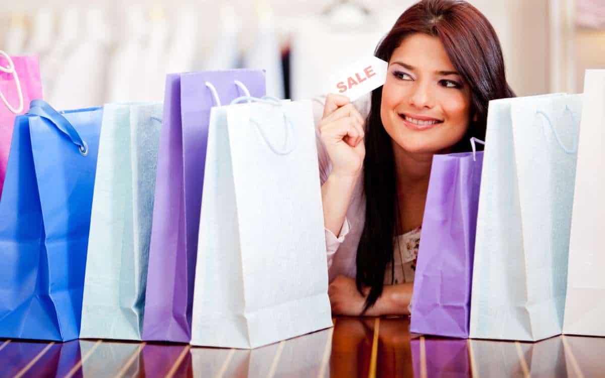 Woman with several shopping bags_Ways to Live a Rich Life on a Tiny Budget